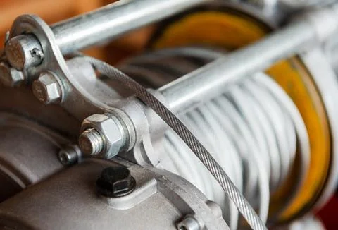 Winch roll of crane the lifting machine in heavy industrial Stock Photos