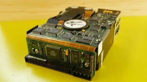 Winchester, hard drive for a computer on a yellow background Stock Footage 160212103
