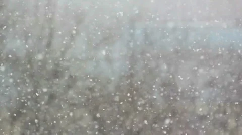 Wind and snow on blue sky background Stock Footage