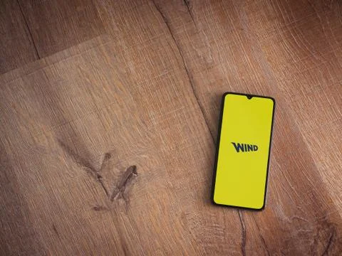 WIND app launch screen with logo on the display of a black mobile smartphone  Fotos de archivo