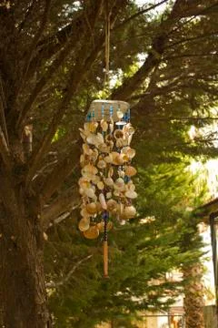 Wind bell hung on a tree Stock Photos
