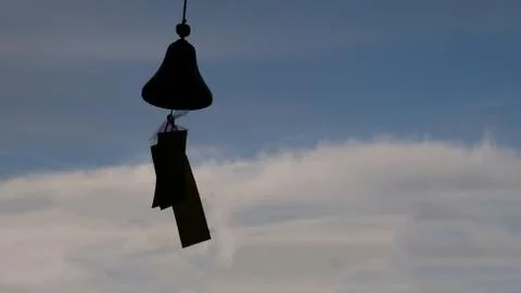 Wind bells chimes compared to the blue sky. Stock Photos