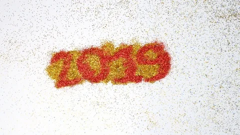 The wind blew red glittery glitter from 2019 to 2020 yellow glitter. Stock Footage 119677779