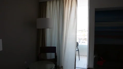 The wind blew the white curtains at the windows on deck. 스톡 동영상 106346839