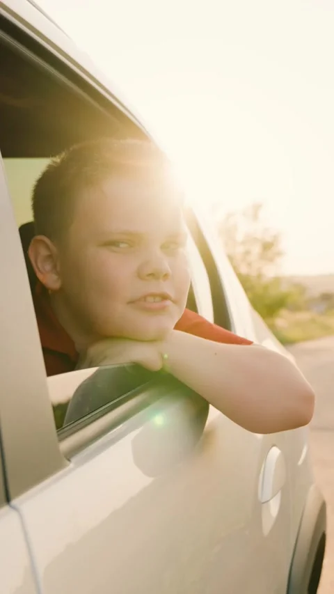 Wind blowing face from car window, hand out car window, good weekend, looking Stock Footage 271678279