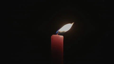 Wind Blowing Flame of a Red Candle Stock Footage 39375900