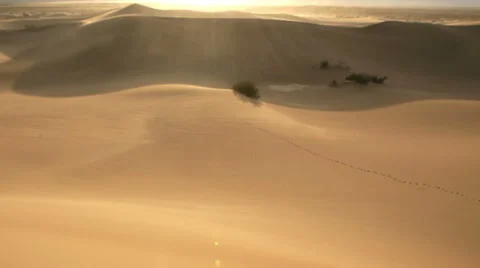 Wind blowing over desert sand dunes Stock Footage 54684743