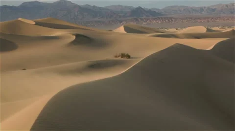 Wind blowing over desert sand dunes Stock Footage 54685018