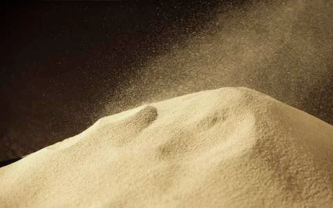 Wind blowing over sand dune Stock Photos