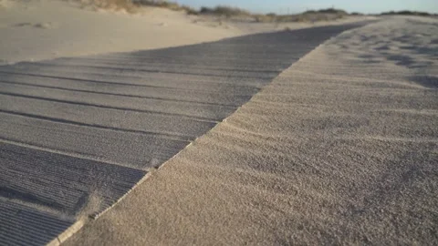 Wind blowing sand through dunes boardwalk Video stock 163557276