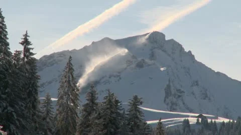 Wind Blowing Snow Over the Crest of Mountain Video stock 10748346
