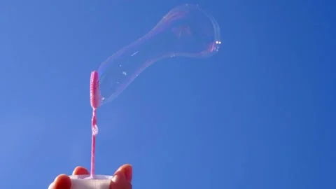 Wind blowing soap bubbles in slow motion Stock Footage 131041281