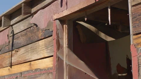 Wind Blowing Through a Torn Screen on Ghost Town Cabin - Shallow DOF Video stock 144734909