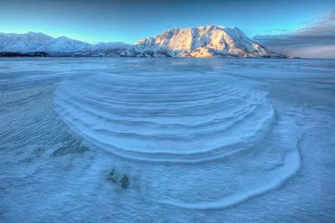 Wind blown snow create interesting patterns on the frozen surface of Kluane Stock Photos
