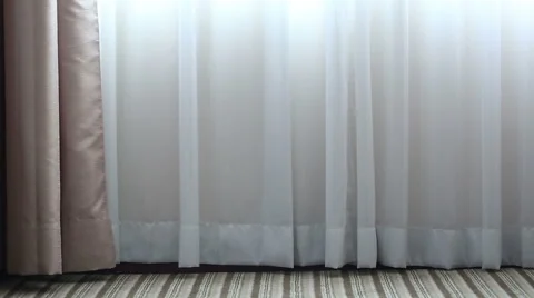 The wind blows and light shines through white curtains Stock Footage 51562602