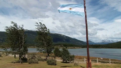 Wind blows Argentinian flag in Tierra del Fuego National Park Stock Footage 78259242