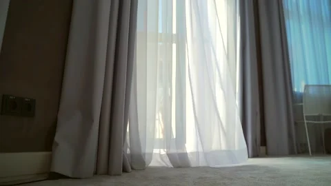 Wind blows the curtain or sways blind in the house or hotel. Sunny day with open Stock Footage 162115167