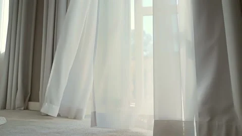 Wind blows the curtain or sways blind in the house or hotel. Sunny day with open Stock Footage 162115187
