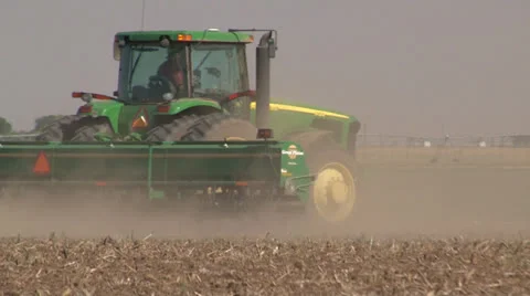 Wind blows dust behind farm tractor during West Texas drought Stock Footage 25175990