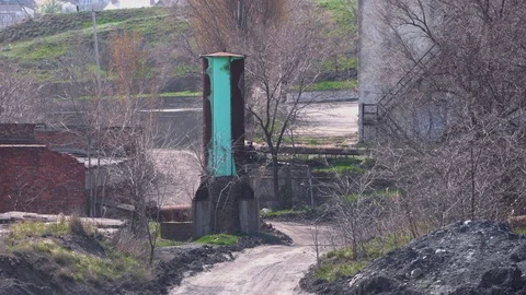 Wind blows dust on the clay road near the plant Stock Footage 105727123