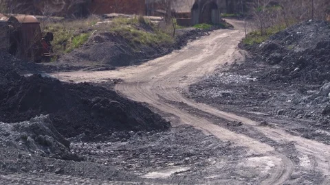 Wind blows dust on the dusty road near the plant Stock Footage 105728811