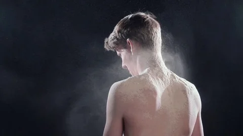 Wind blows dust off a young man Stock-Footage 75342851