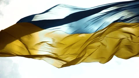 The wind blows the flag of Ukraine against the background of the sunny sky. 스톡 동영상 201213871