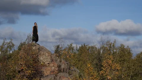 The wind blows on the girl on the mountain Stock Footage 105282191