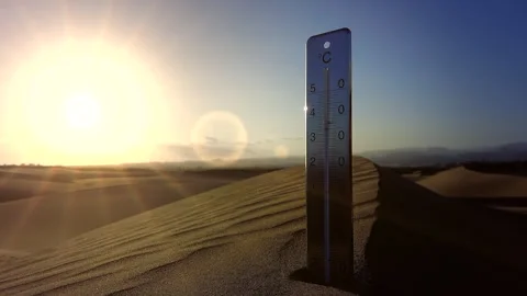 Wind blows over a dune where a thermometer is stuck, global warming concept. Stock Footage 264800935