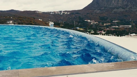 The wind blows over the surface of the pool Stock Footage 99079502