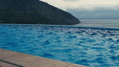 The wind blows over the surface of the pool Stock Footage 99081329