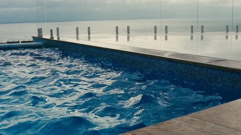 The wind blows over the surface of the pool Stock Footage 99083198
