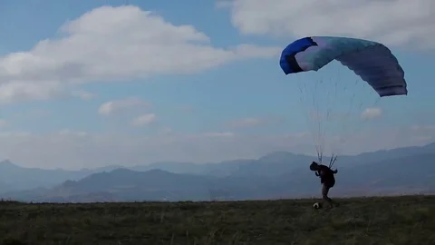 The wind blows paraglider Stock Footage 69187414