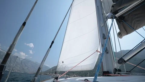 The wind blows into a sail. Sail throws in different directions. Stock Footage 109420247