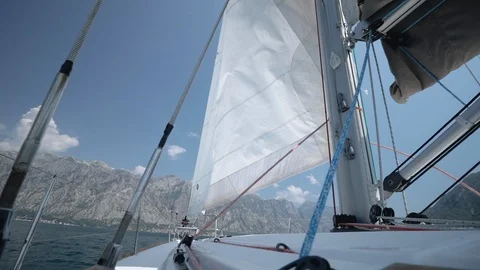 The wind blows into a sail. Sail throws in different directions. Stock Footage 109425547