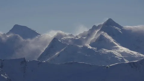 Wind blows snow from the tops Stock Footage 82744579