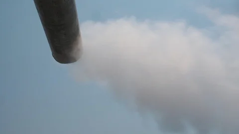 The wind blows through smoke or vapor steam in the sky from smoke chimney. Stock Footage 125180326