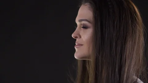 Wind blows on woman's face Video stock 114984794