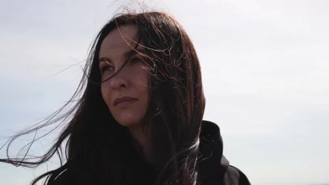 Wind blows the woman's hair Stock Footage 177385337
