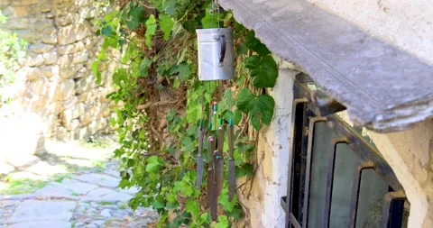 Wind chime on the door of an old house Stock Footage 213619367