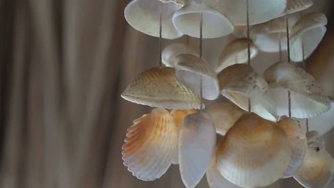 Wind chime sea shells on blur background Vídeos de archivo 86887598