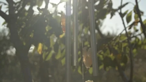 Wind chimes in the garden sunlight Stock Footage 163847271