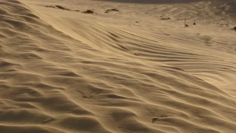 The wind creates intricate patterns on the sand dunes in the desert Stock Footage 152041343