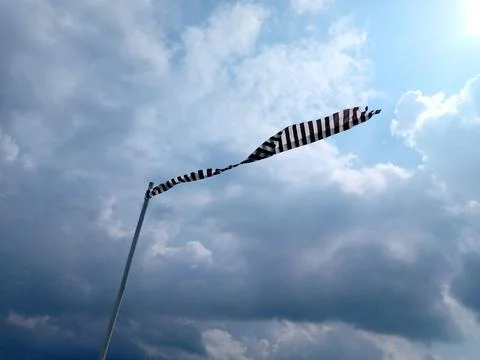Wind direction and partly cloudy skies Stock Photos