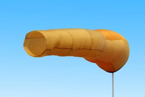 Wind direction flag on blue cloud sky in  wind Stock Photos