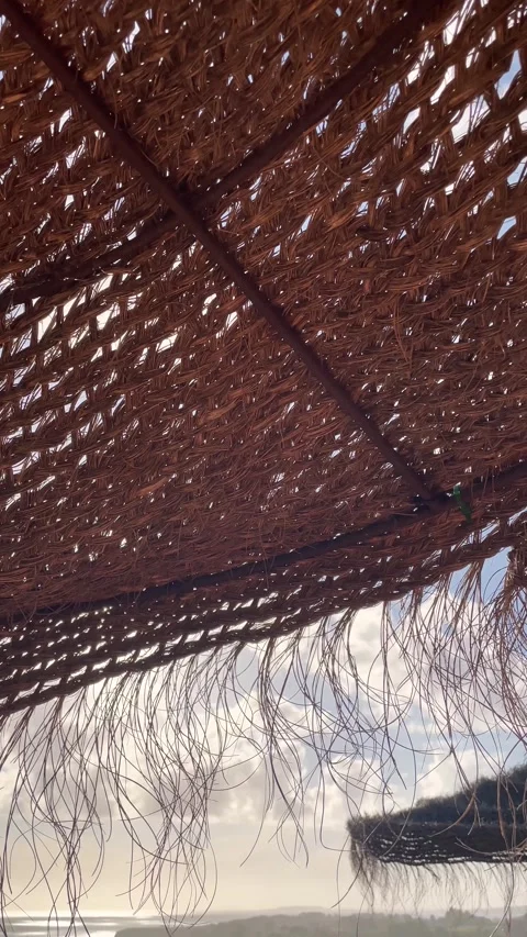 Wind-driven parasol made of natural materials. 動画素材 240755608