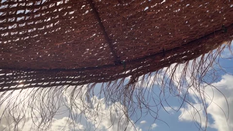 Wind-driven parasol made of natural materials. Stock Footage 245226234