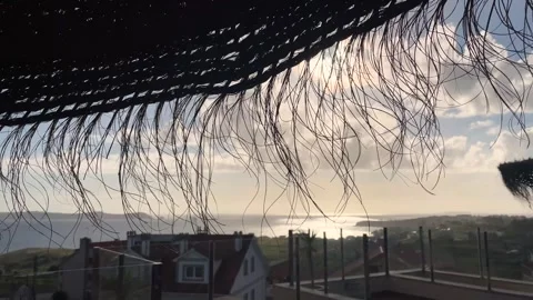 Wind-driven parasol made of natural materials. Soft movement of the wind. Stock Footage 245226274