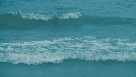 The wind drives the waves towards the shore in slow motion Stock Footage 289736973