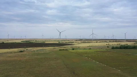 Wind electricity generators in summer fields, power plant, wind efficiency, wind Stock Footage 142571703